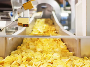 What are industrial continuous fryers?